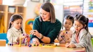 Teacher engaging with children in classroom
