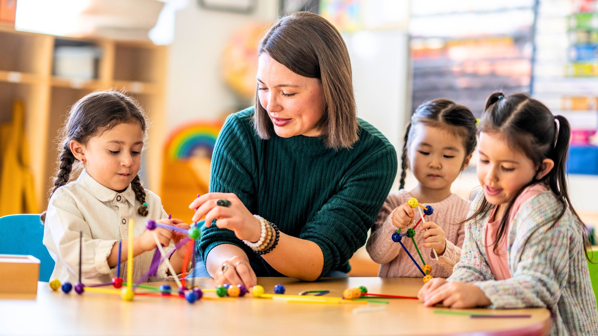 Teacher engaging with children in classroom